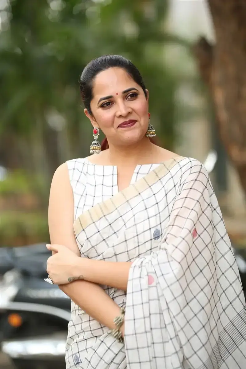 Anasuya Bharadwaj in White Saree at Razakar Movie Launch